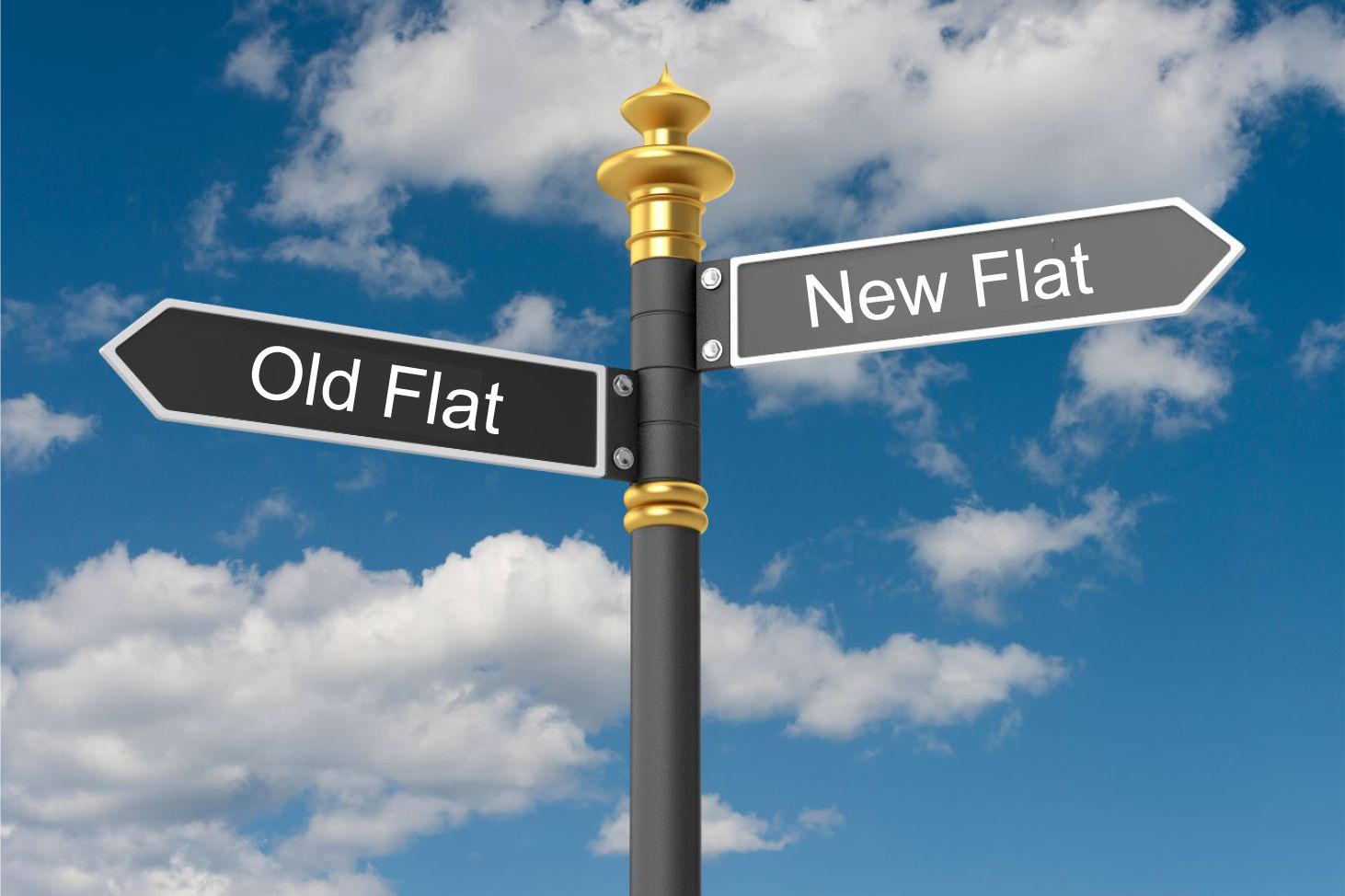 Direction board pointing to Old Flats and New Flats. In the background there is blue sky.