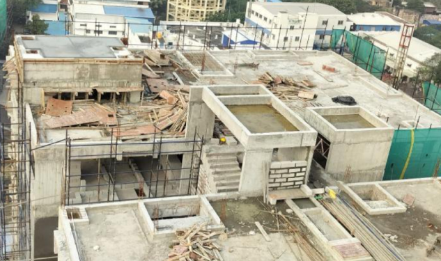 DRA Infinique construction update on 05-02-2026 showing TOWER 1 ABOVE TERRACE OHT WALL AND COVER SLAB WORK COMPLETED in Flats in Valasravakkam - Chennai.