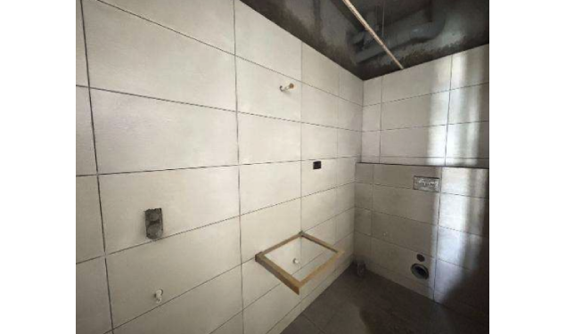 DRA Infinique construction update on 25-06-2026 showing 11th floor bathroom wall and floor laying work in progress View in Flats in Valasaravakkam - Chennai.